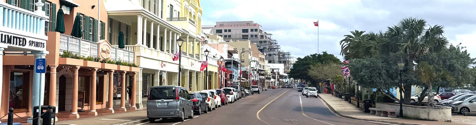 Front Street, Hamilton — colourful buildings and palm trees